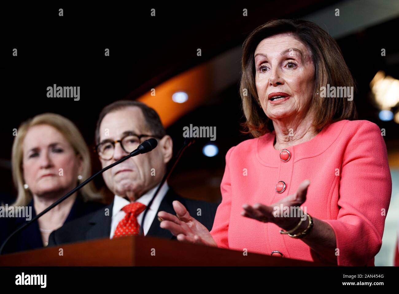 Washington, USA. 15th Jan, 2020. U.S. House Speaker Nancy Pelosi (R) speaks during a press conference in Washington, DC, the United States, on Jan. 15, 2020. The U.S. House of Representatives officially sent impeachment articles against President Donald Trump to the Senate on Wednesday evening to allow a trial to get underway. Credit: Ting Shen/Xinhua/Alamy Live News Stock Photo