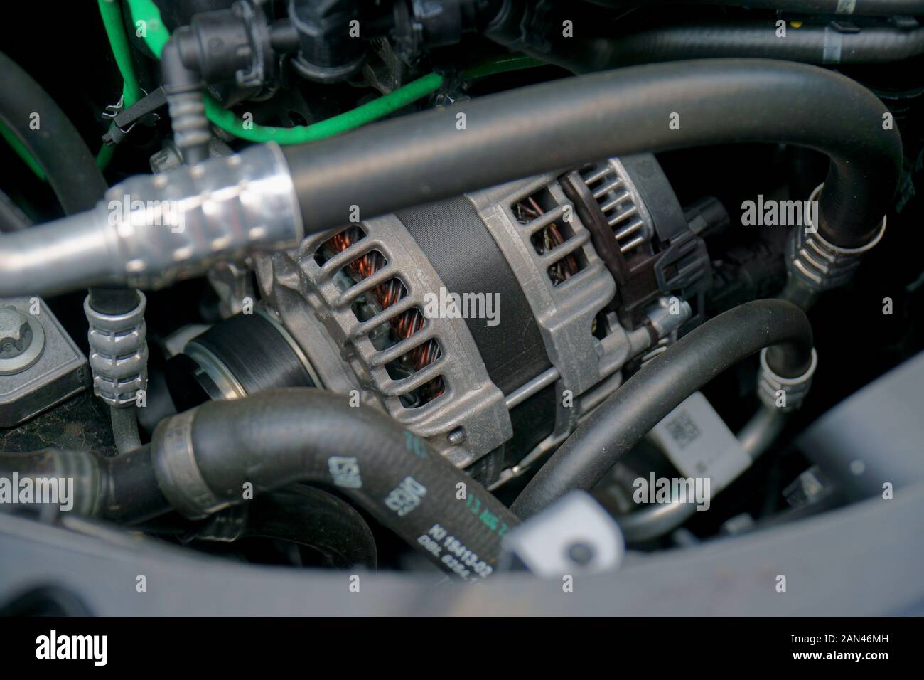 Alternator in engine bay of a car Stock Photo