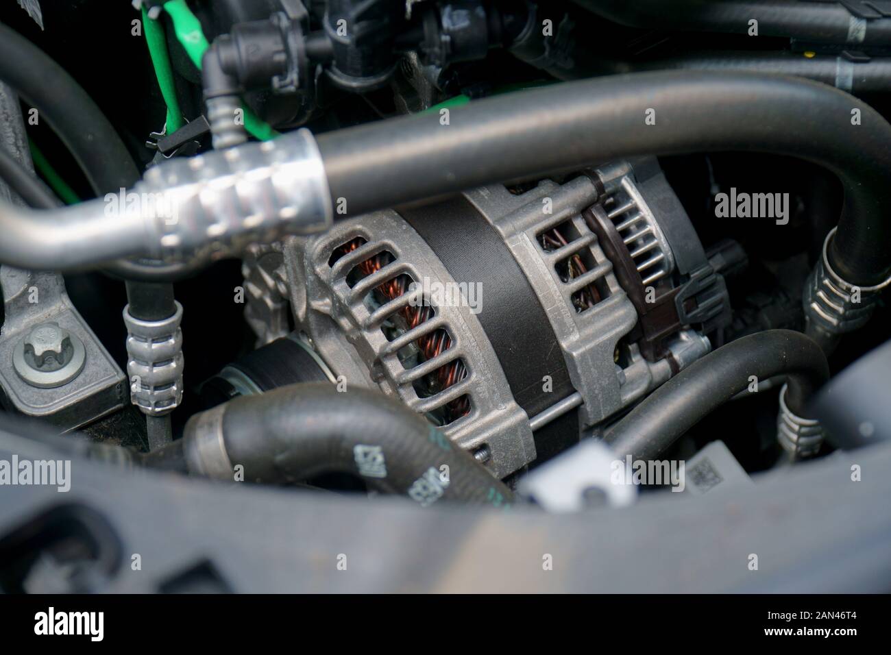 Alternator in engine bay of a car Stock Photo