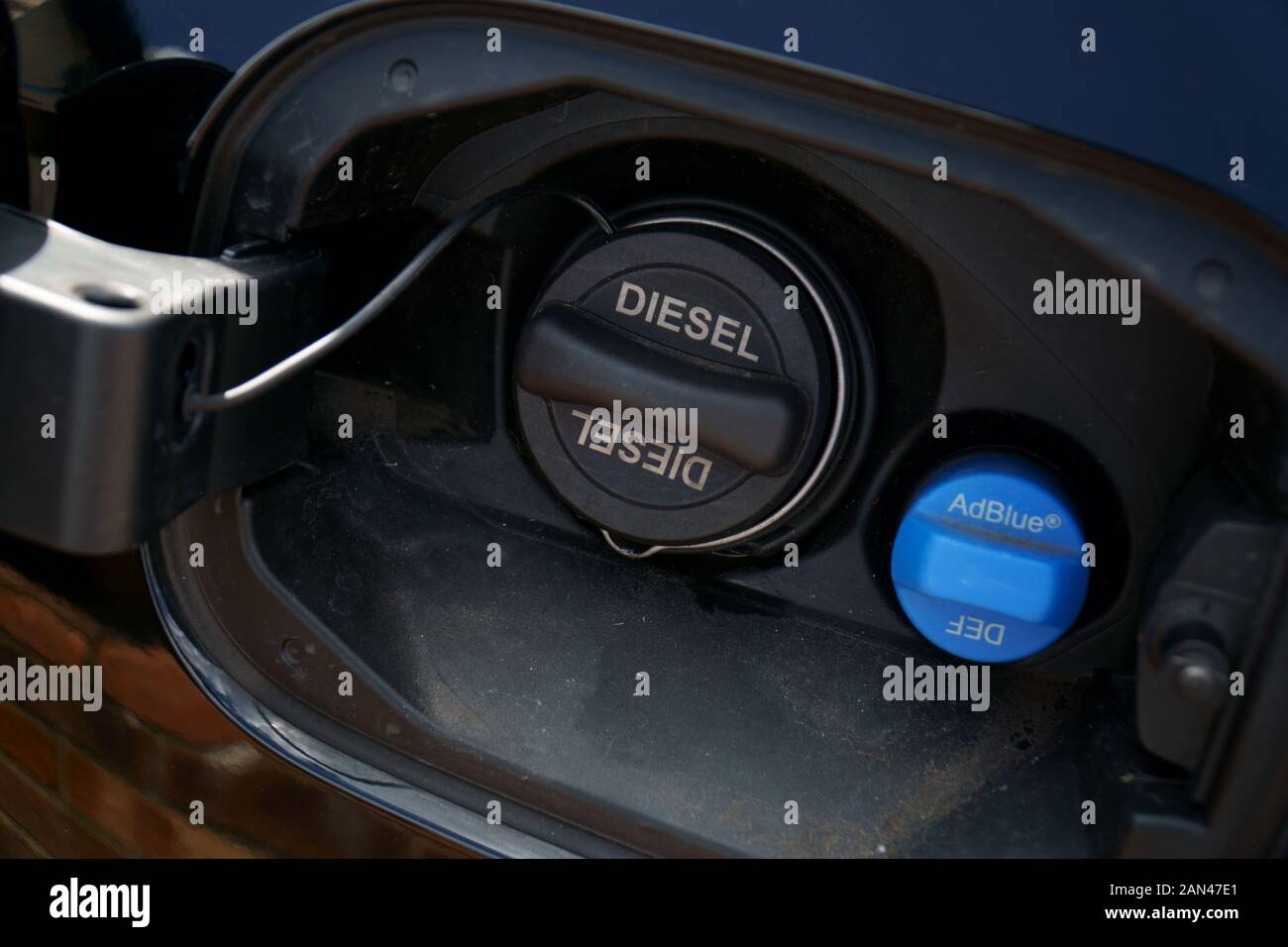 Fuel filler cap on modern diesel car with AdBlue Stock Photo