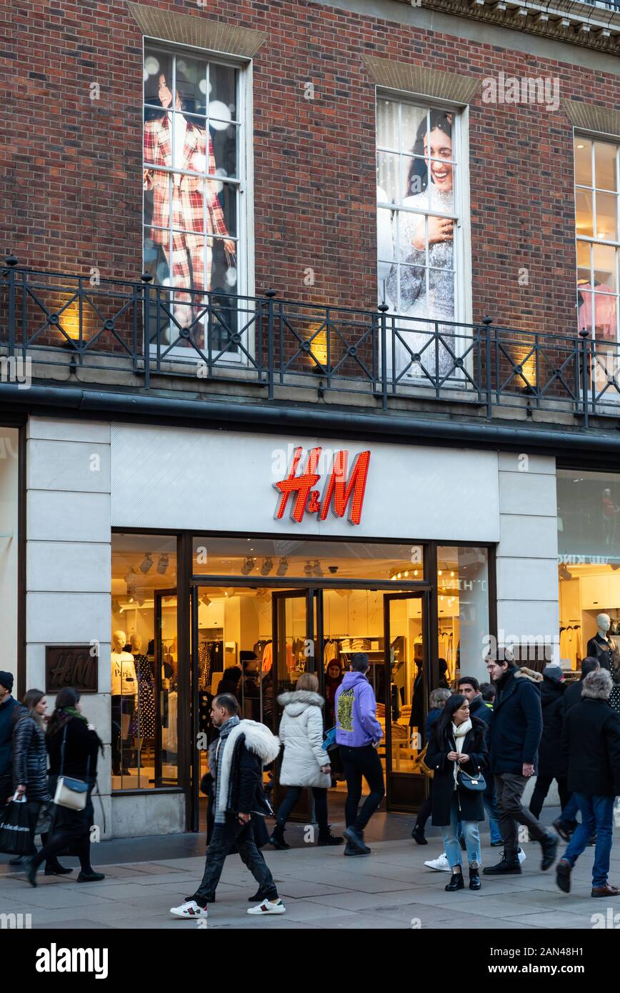 Oxford Street London retail H&M retail store shop front in Oxford Street,  London and people walking by on early evening Stock Photo - Alamy