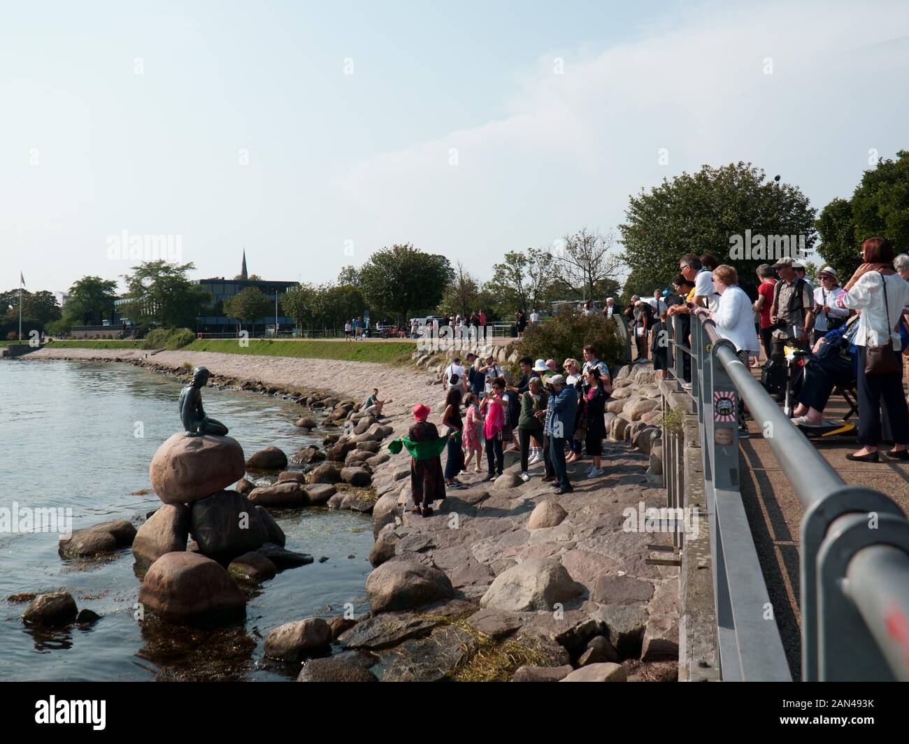 Tourists at The Little Mermaid in Copenhagen, Denmark Stock Photo