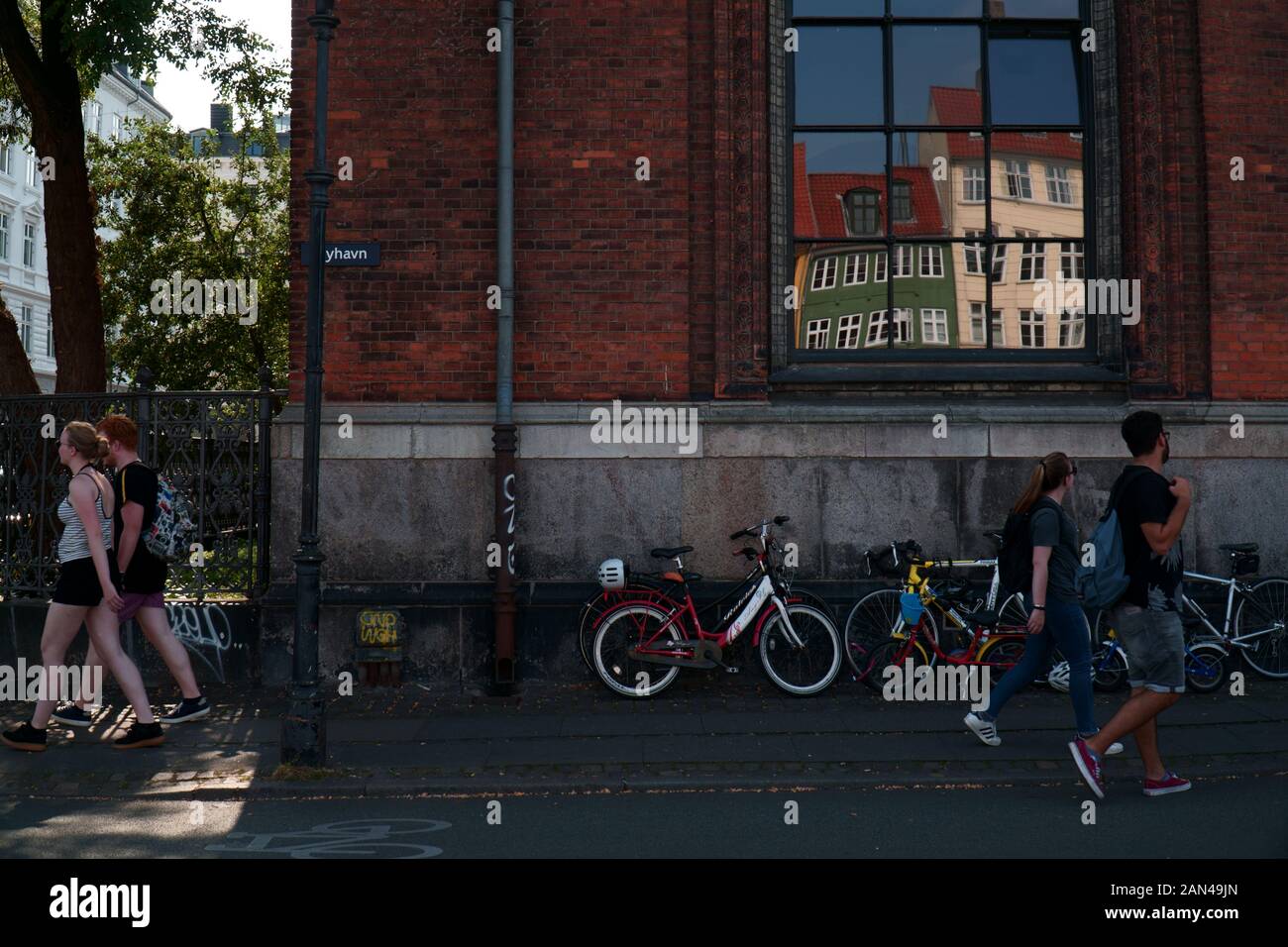 Bikes parked by a building in Nyhavn, Copenhagen Stock Photo