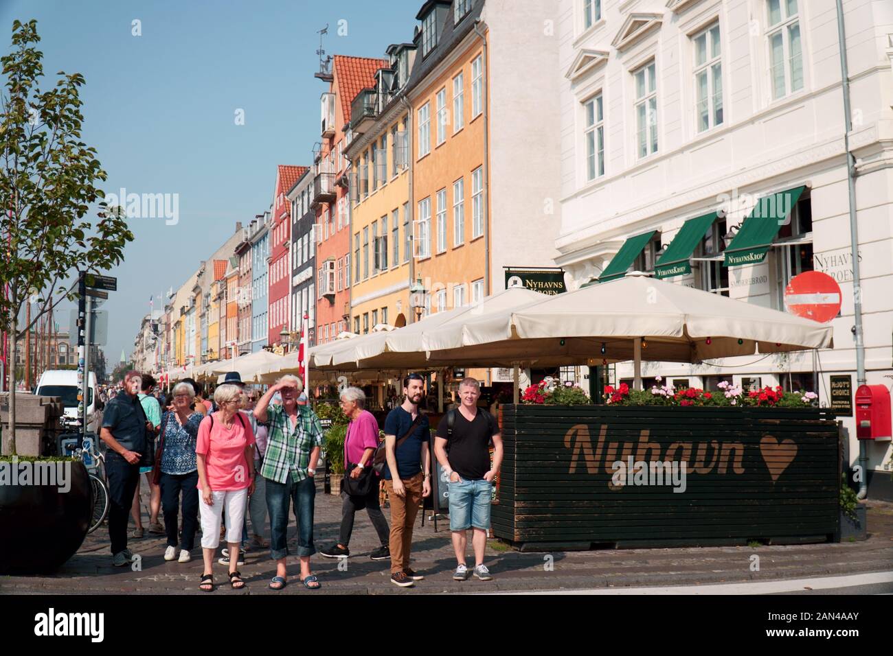 People waiting to cross a road in Nyhavn, Copenhagen Stock Photo