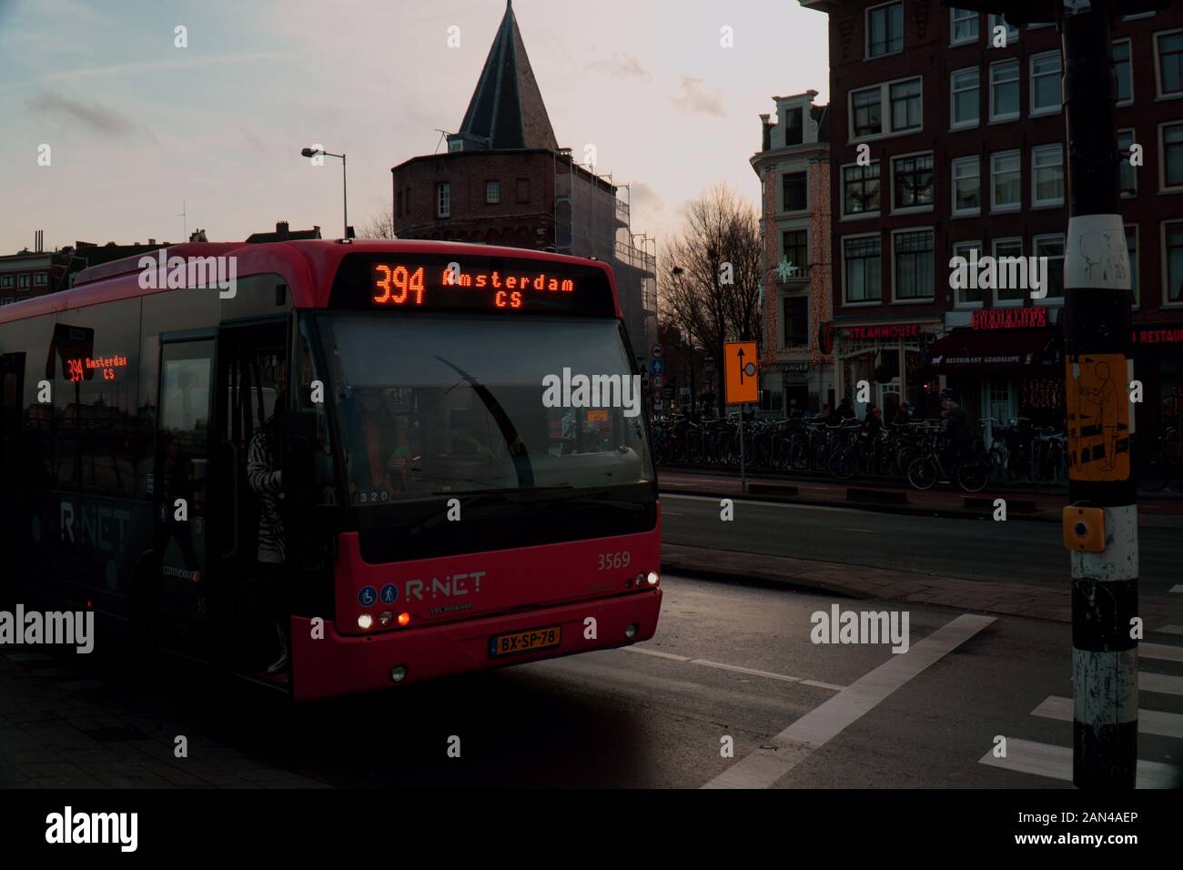 Bus stopped at traffic light in Amsterdam, Netherlands Stock Photo