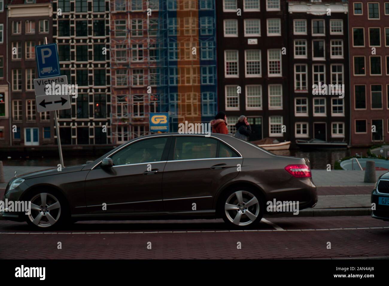 Mercedes-Benz E-Class parked by a canal in Amsterdam, Netherlands Stock Photo