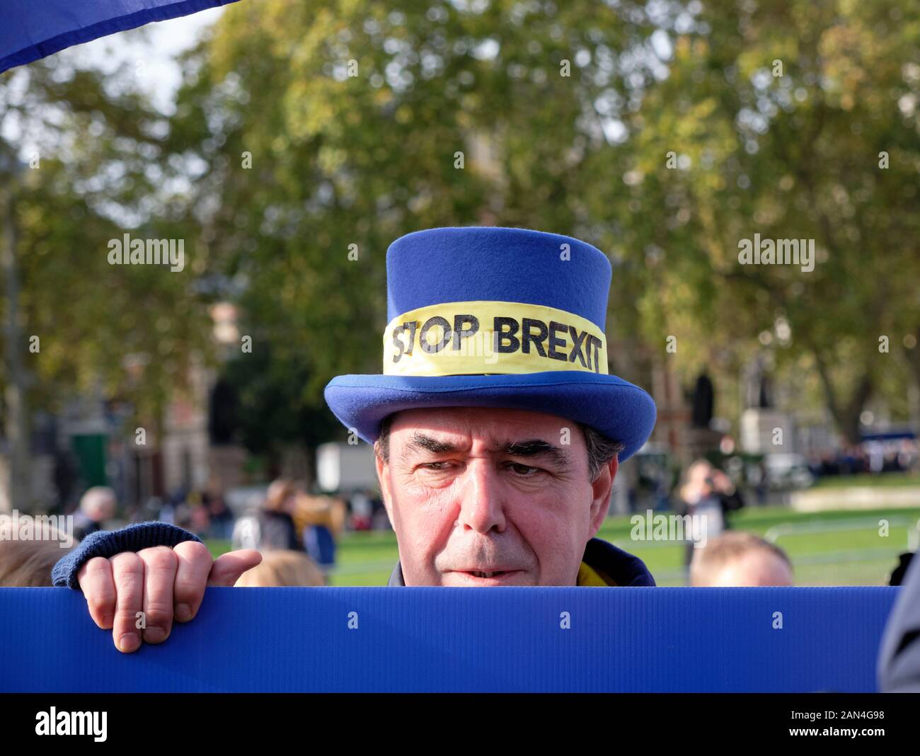 Head of Mr Stop Brexit,  Steve Bray appearing above a blue banner as if to say I'm still here Stock Photo