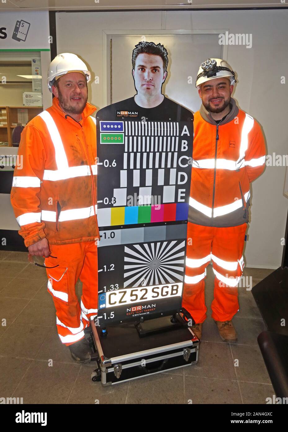 Railway contractors with a Norman CCTV Test Target - National Operational Requirement Mannequin, used for CCTV installation and calibration Stock Photo