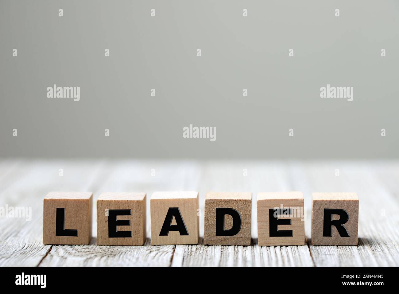 Leader word written on wood block Stock Photo Alamy
