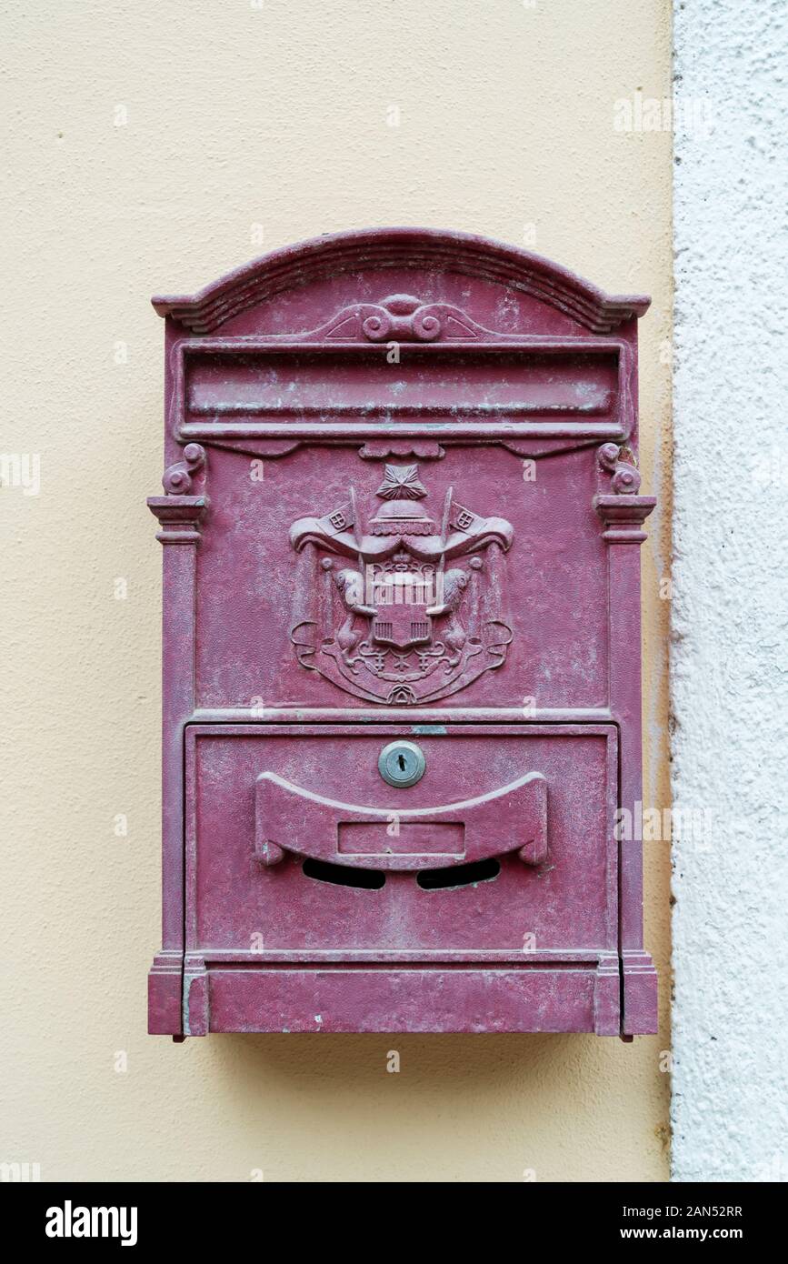 Postbox with a coat of arms in the wall in the Italian town Vernazza of the coastal area Cinque Terre Stock Photo