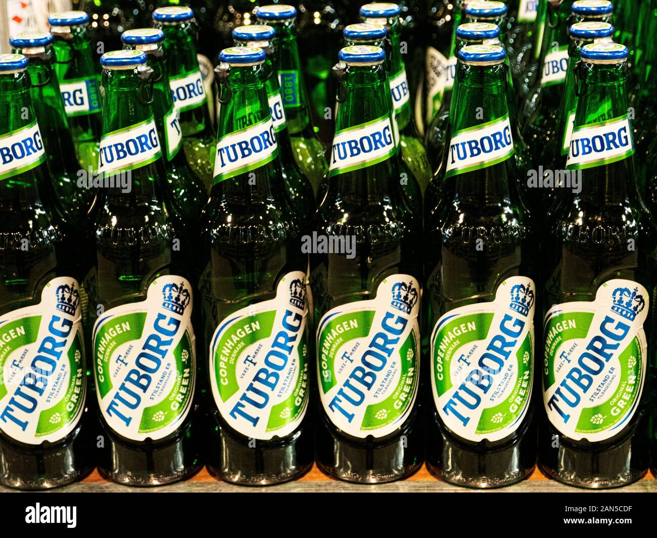 Tuborg beer bottles seen in a store shelf. Stock Photo