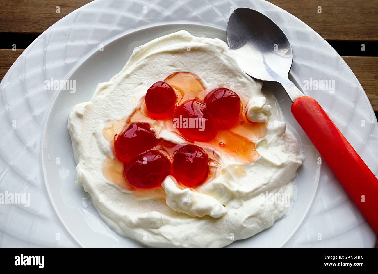 Bowl of Greek Yogurt with Cherries in Syrup Stock Photo Alamy