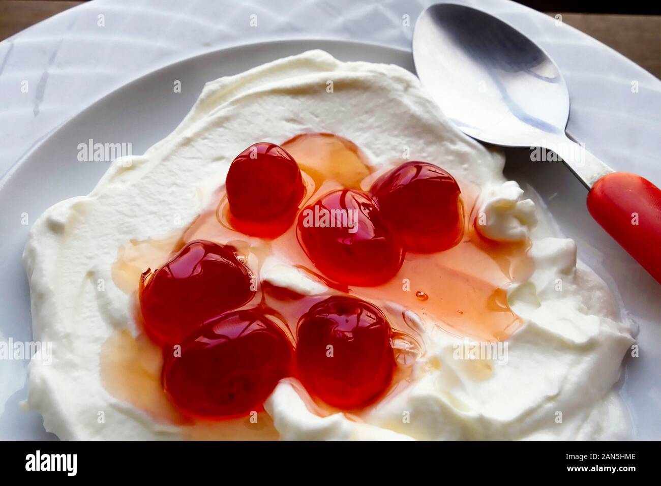 Bowl of Greek Yogurt with Cherries in Syrup Stock Photo Alamy