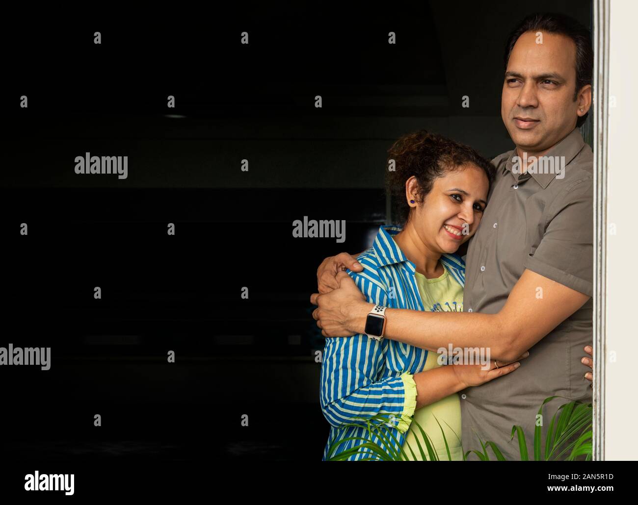 Young wife hugging her husband. Stock Photo