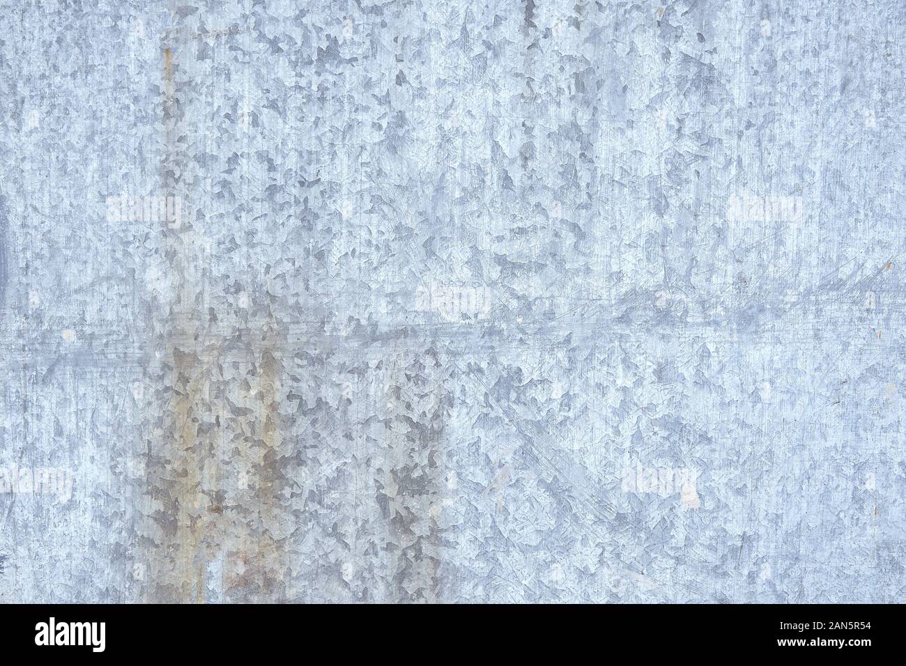 galvanized metal texture with old peeling paint. Metal background, copyspace. view from above. Stock Photo