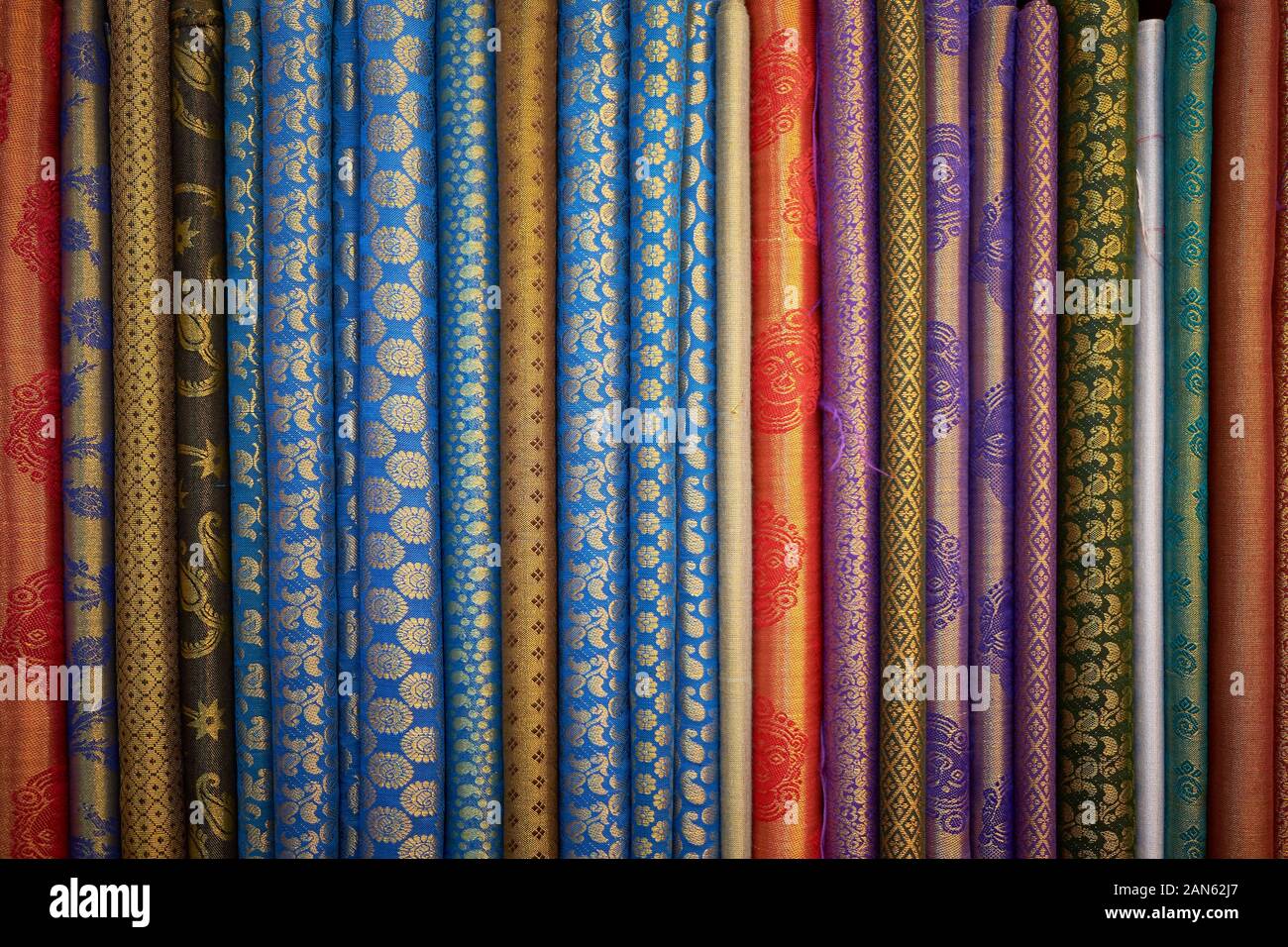 A variety of traditional Sari, Salwar Kameez Indian fabric on display. At a fabric, clothing store in downtown Kuala Lumpur, Malaysia. Stock Photo