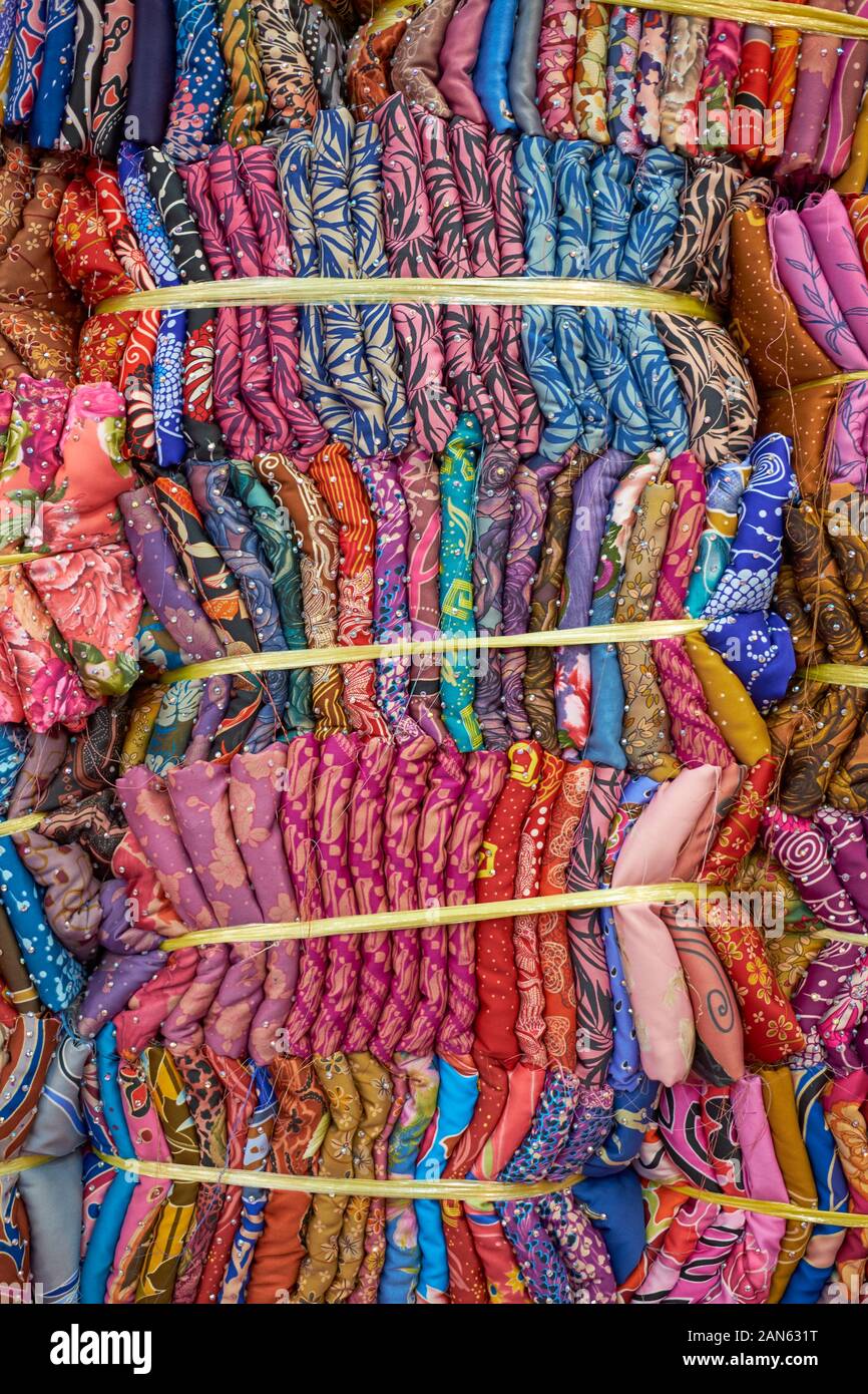 Many bundles of traditional Malay clothing, material, textile, fabric