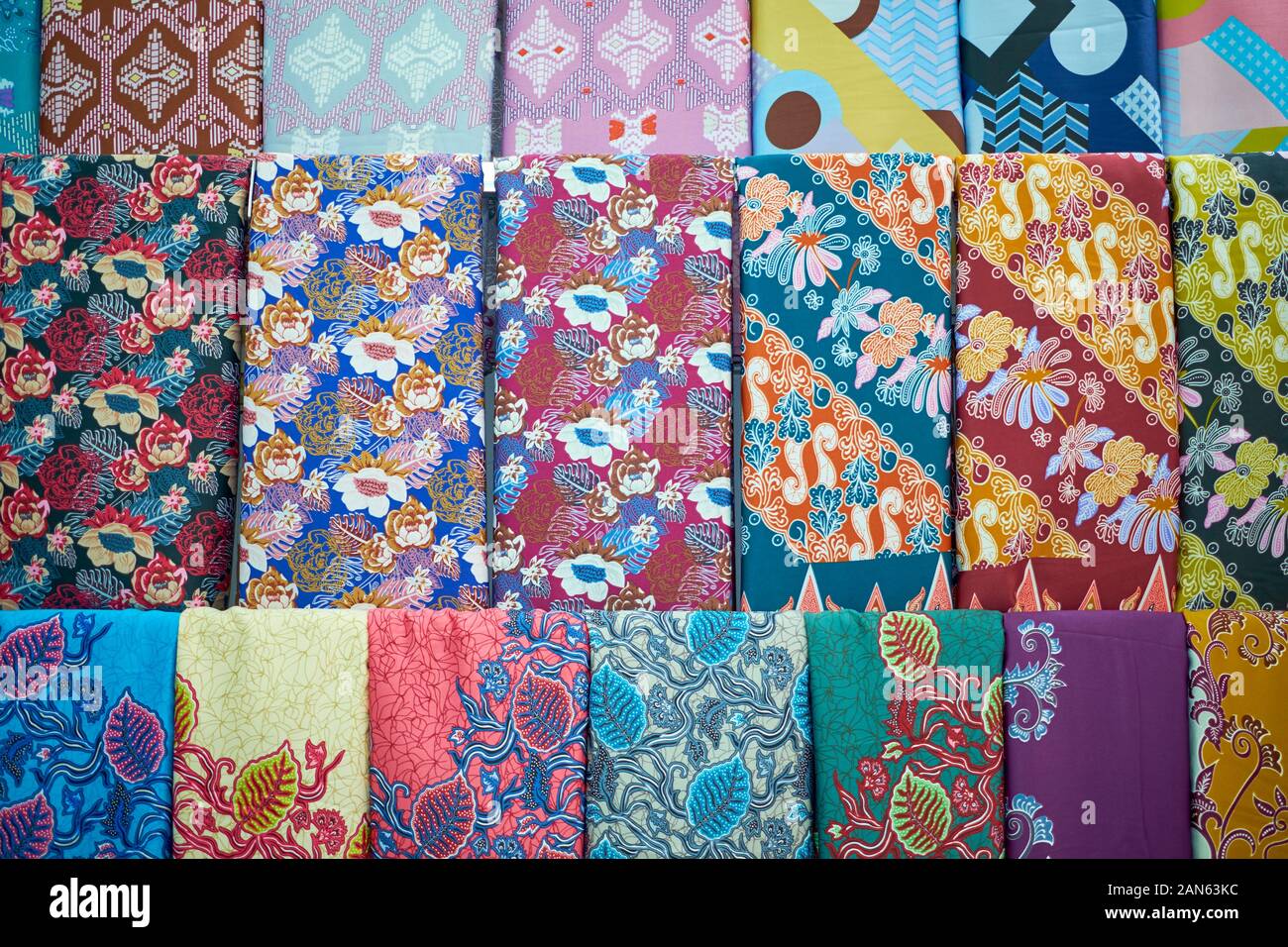A display of colorful, traditional Malay floral design fabric, textiles