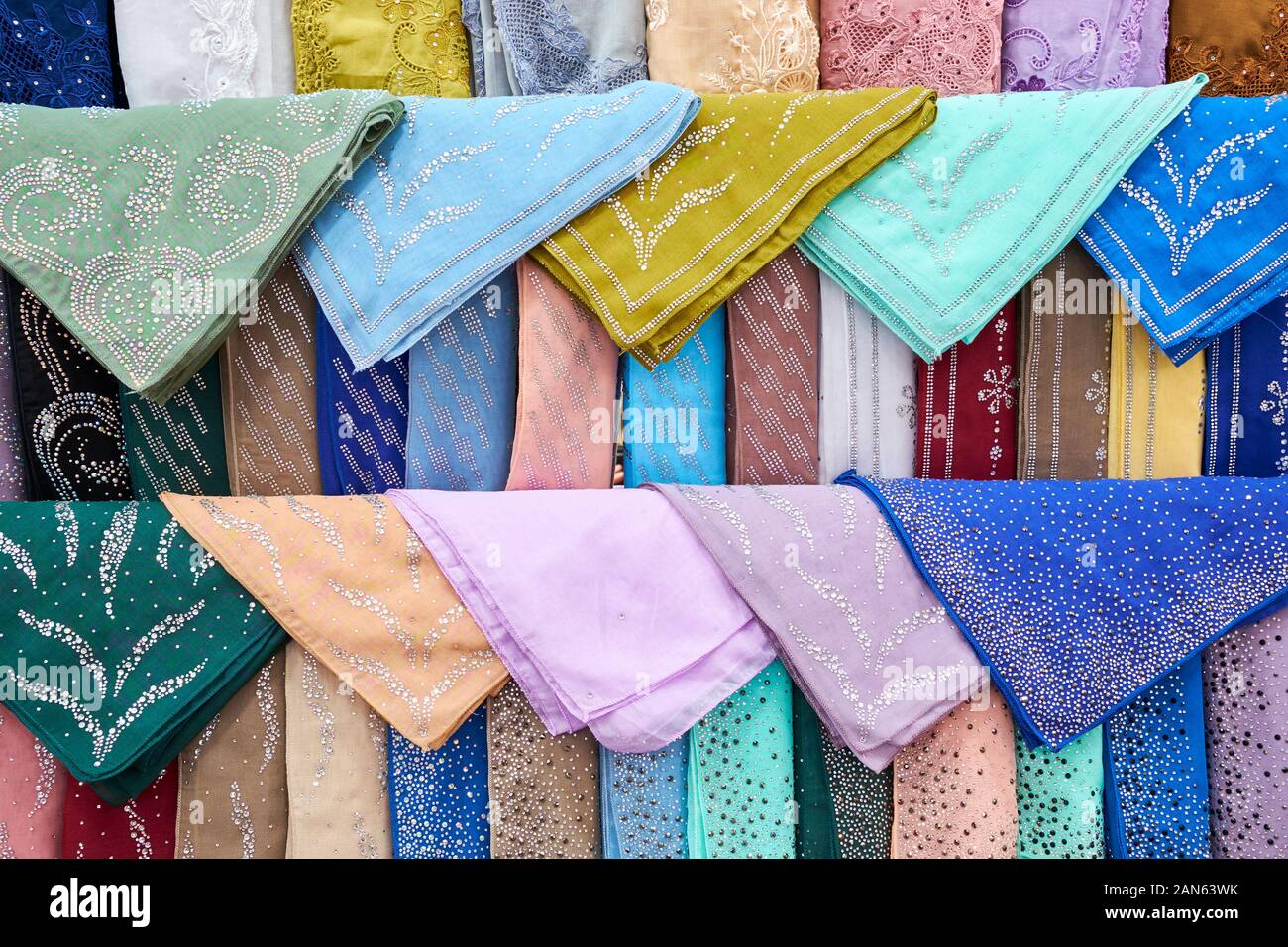 A display of colorful, traditional Hijab, Abaya, Tudong headscarves with rhinestones. At a clothing, fabric, textile store in downtown Kuala Lumpur, M Stock Photo