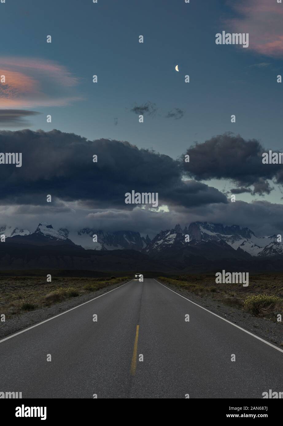 Escape - travelling away from storm over mountains into clear skies Stock Photo