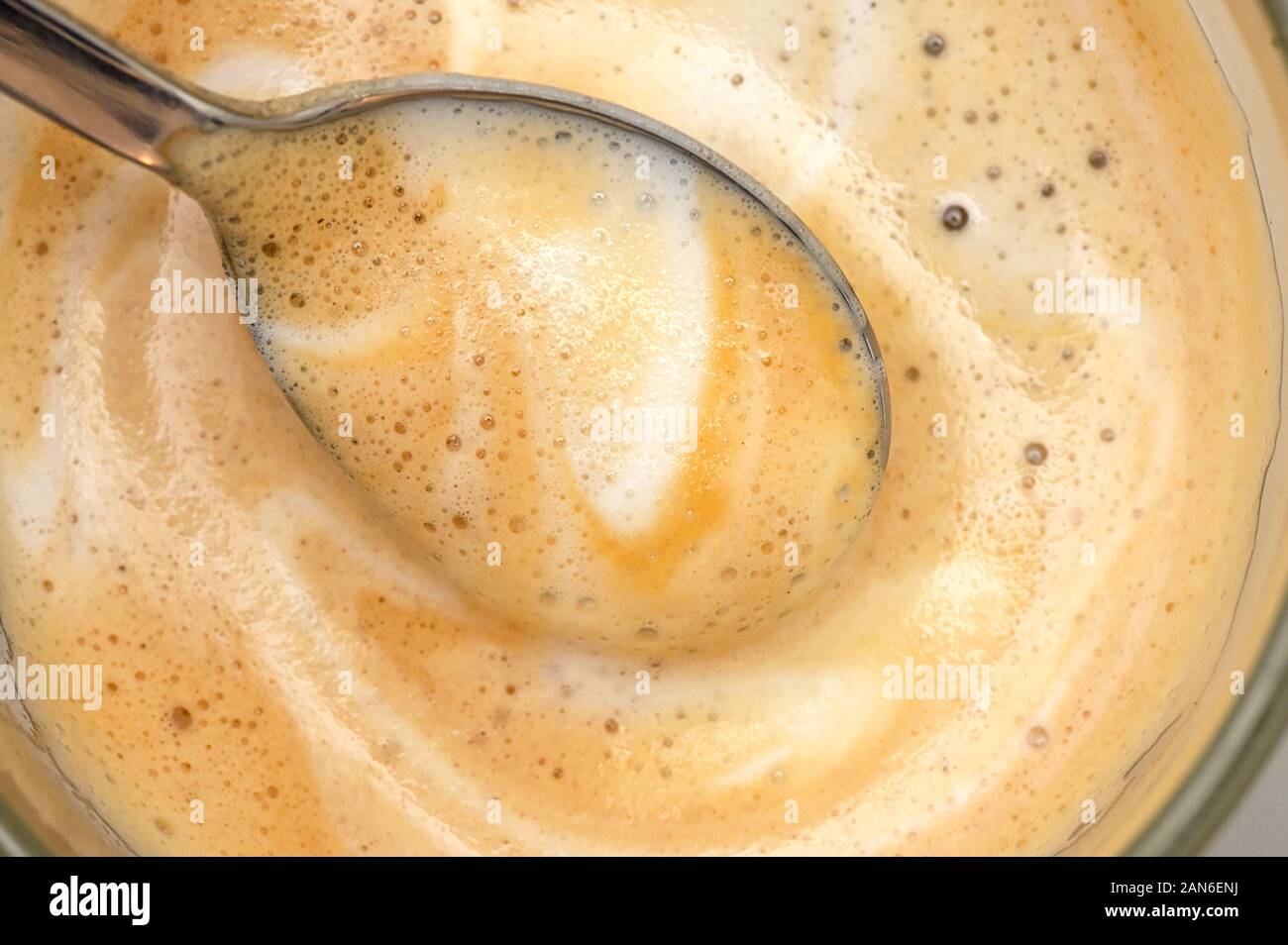 Macro Coffee With Milk And Foam Stock Photo