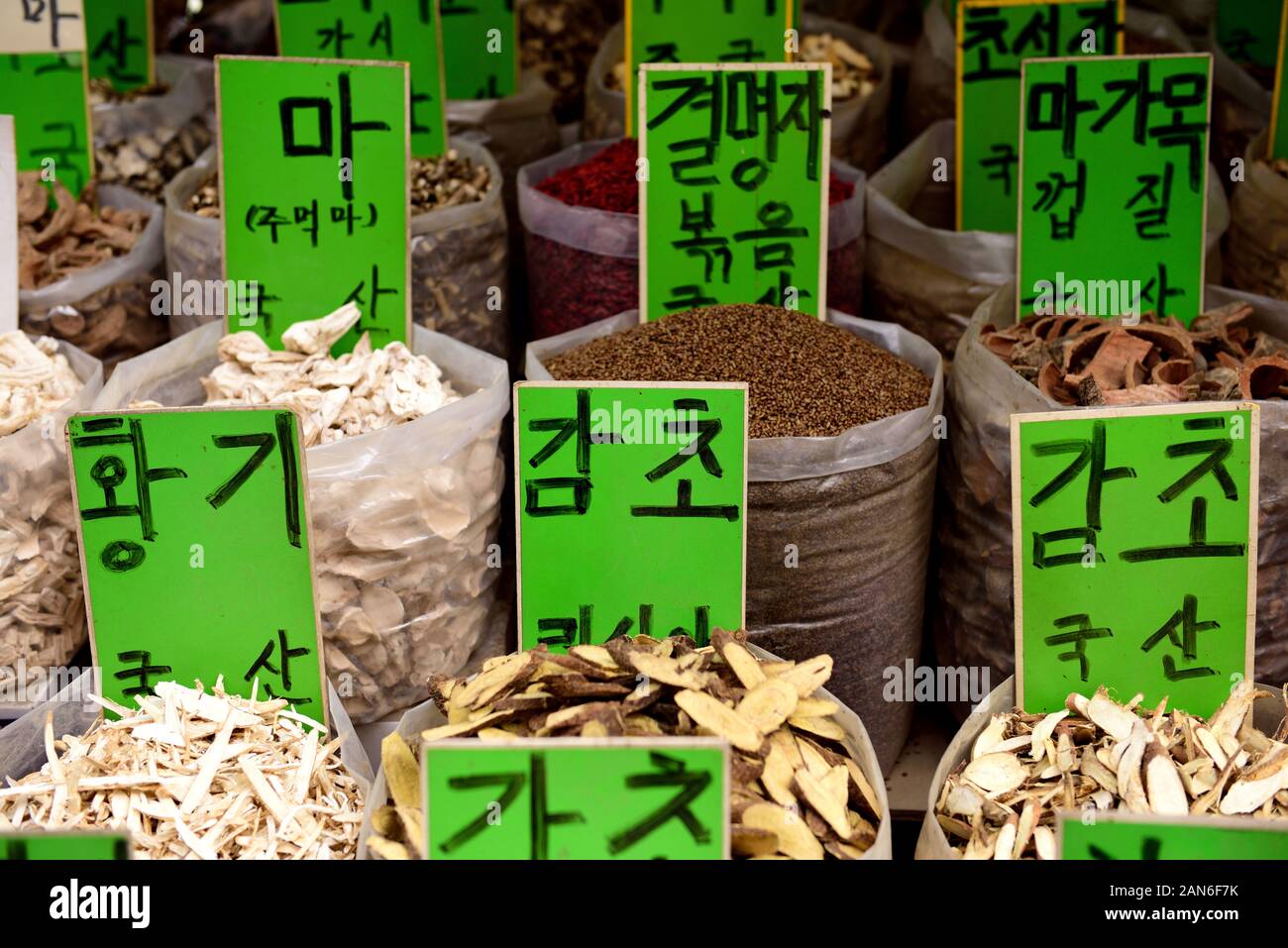 Containers of traditional Korean natural medicine, bark, roots and herbs in a street medicine market in Seoul, South Korea Stock Photo
