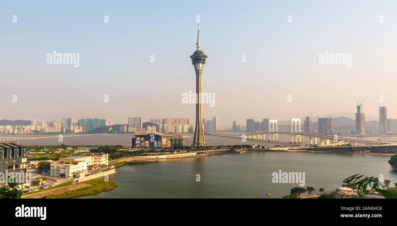 Panorama with Macao Tower in the center. Around the tower the sea and the macanese cityscape. Popular sightseeing spot. Famous for the skyjump. Stock Photo