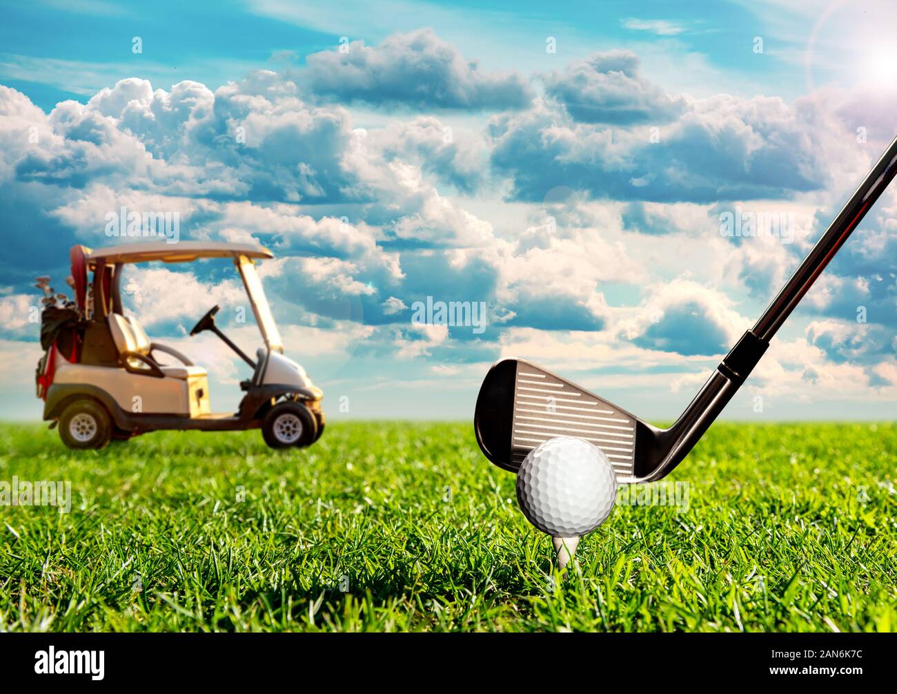 Golf ball on the tee with cart on background Stock Photo