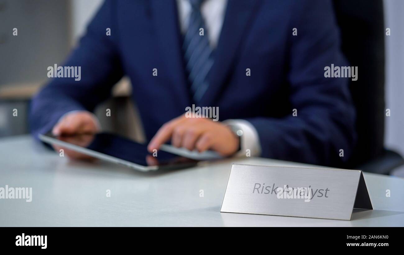 Serious Risk Analyst Working On Tablet Computer Counting New Project Chances Stock Photo Alamy
