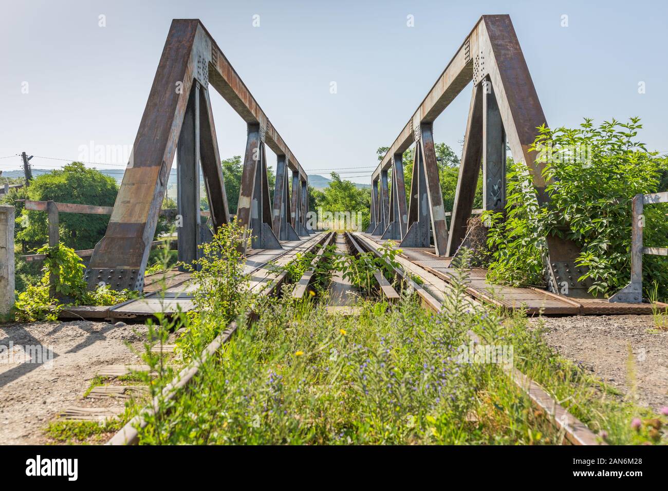 Front view on bridge with steel supports & tracks. Ready to cross the bridge? Concept for support, communiction, collaboration, teamwork, risk. Stock Photo
