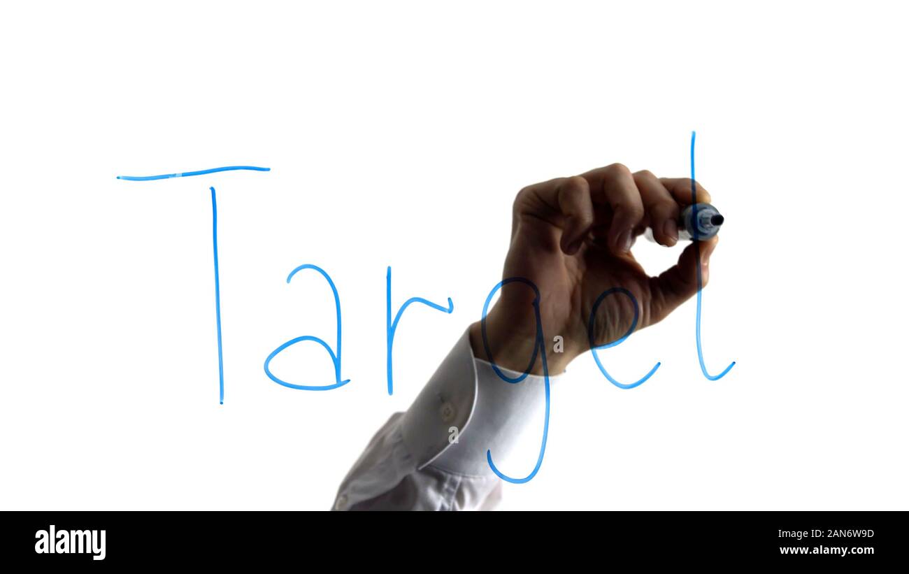 Business man writing target word on glass, strategy, key performance indicators Stock Photo