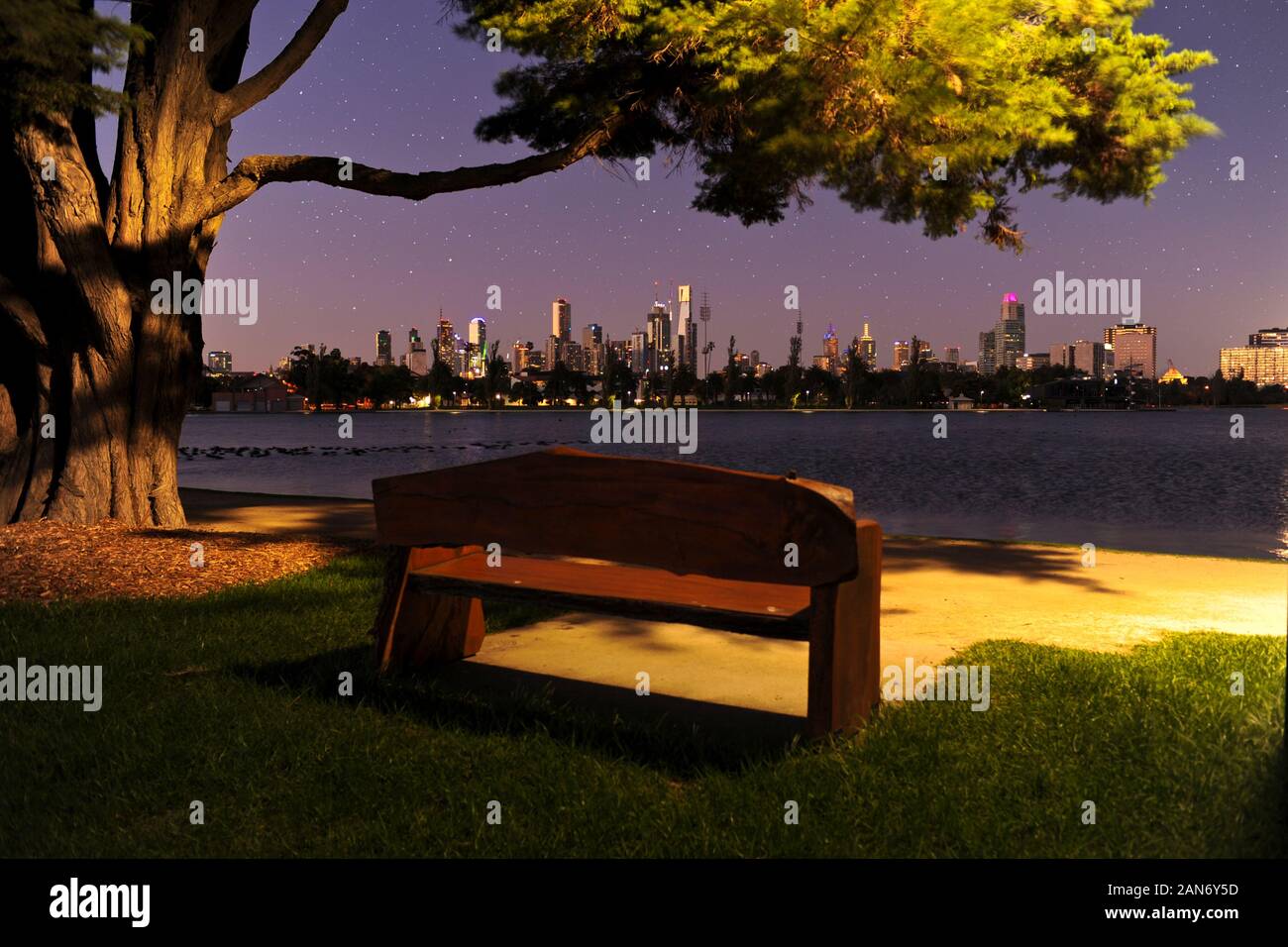 A view of Melbourne at sunset looking across Albert Park lake. Stock Photo