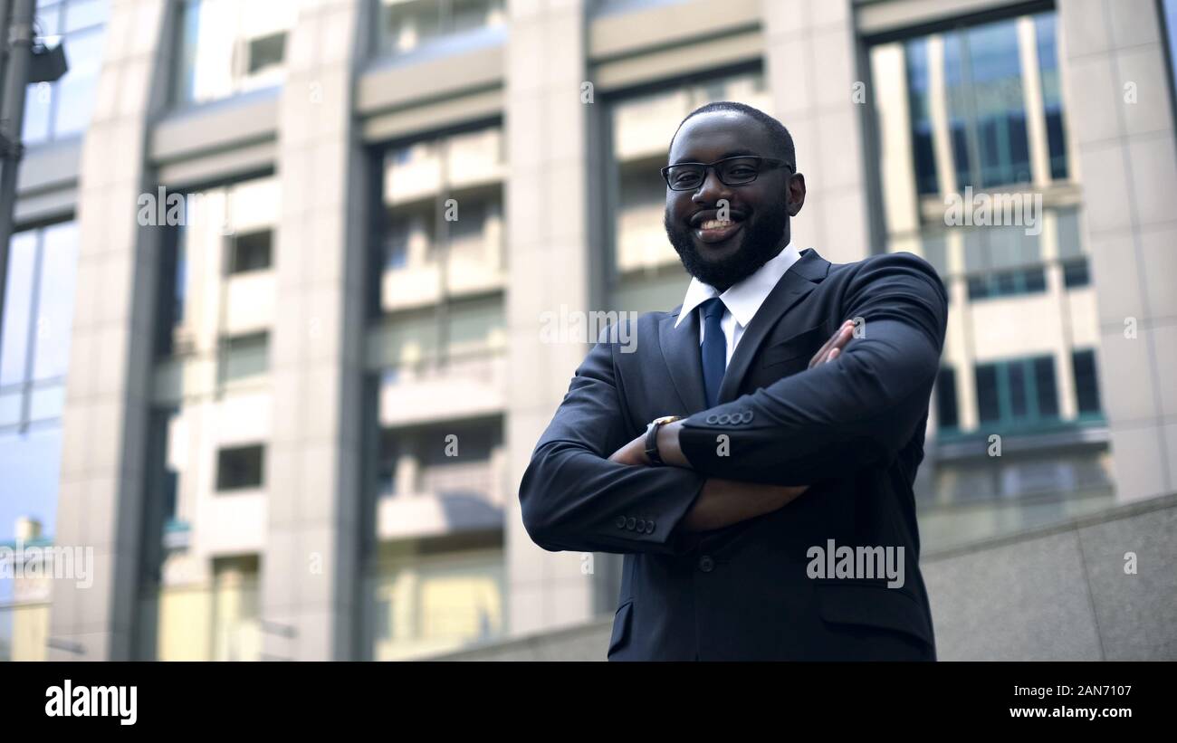 Intelligent businessman posing for camera, personal development, career growth Stock Photo