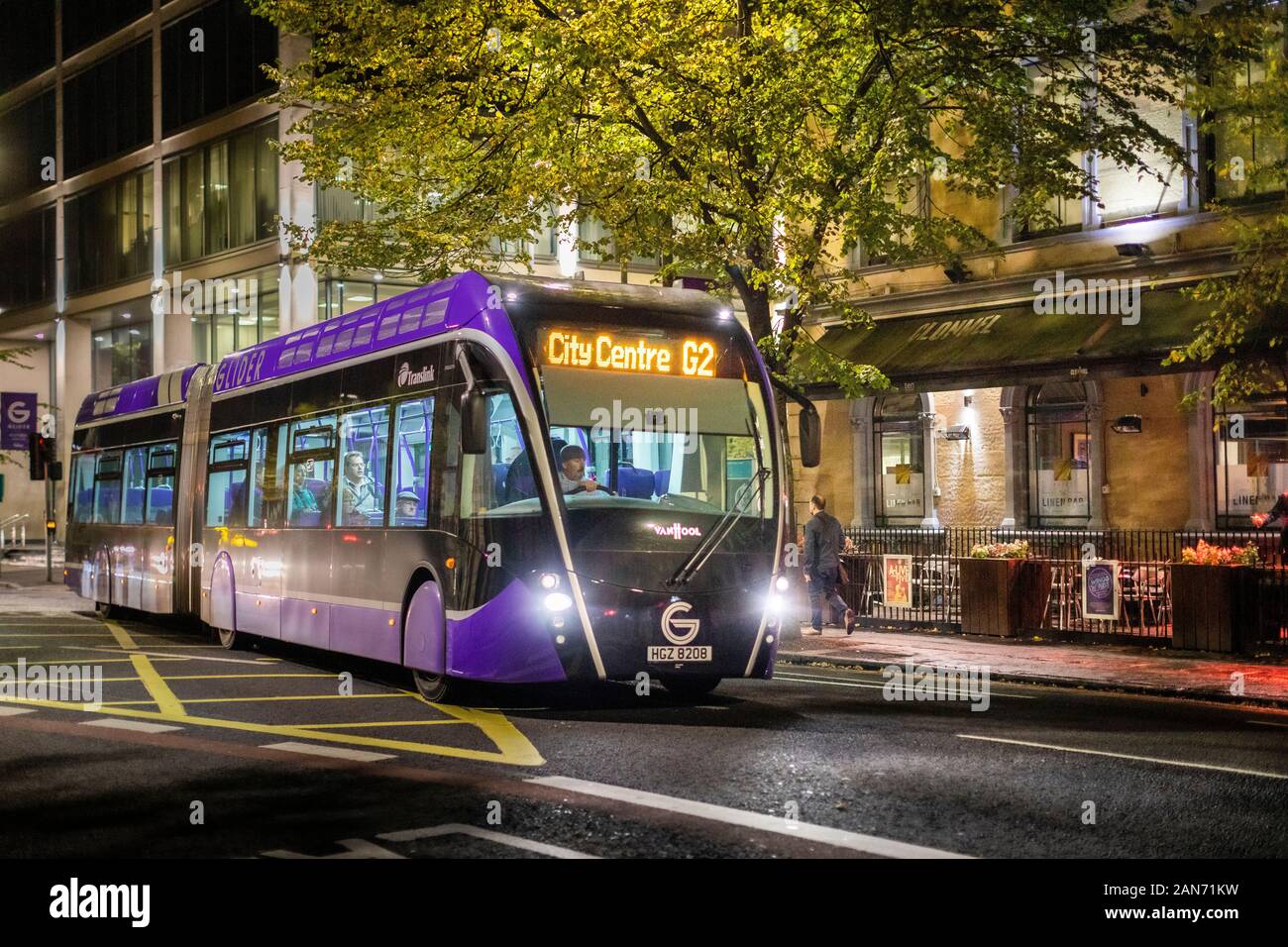 Glider bus at night in Belfast Northern Ireland Stock Photo Alamy