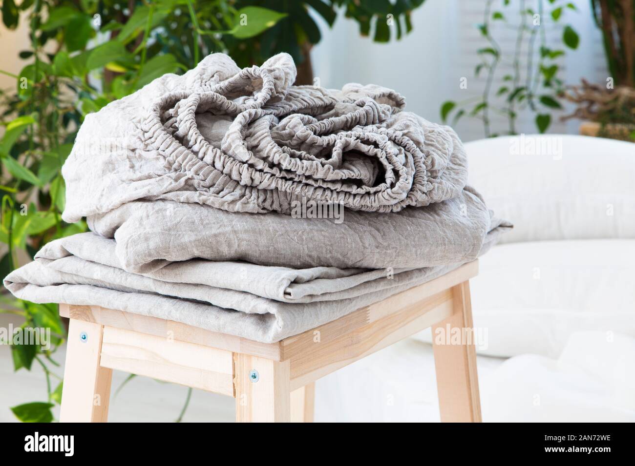 natural ecofriendly linen bed in the interior Stock Photo Alamy