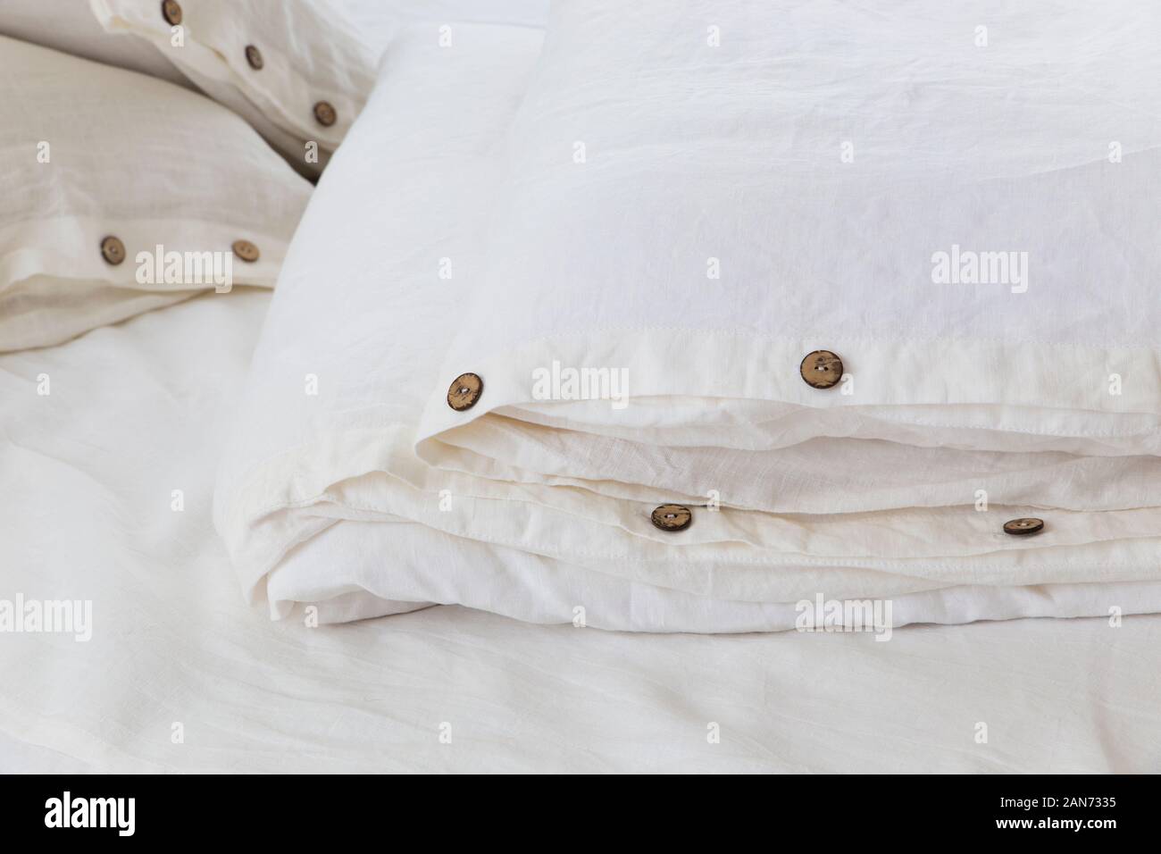 natural ecofriendly linen bed in the interior Stock Photo Alamy
