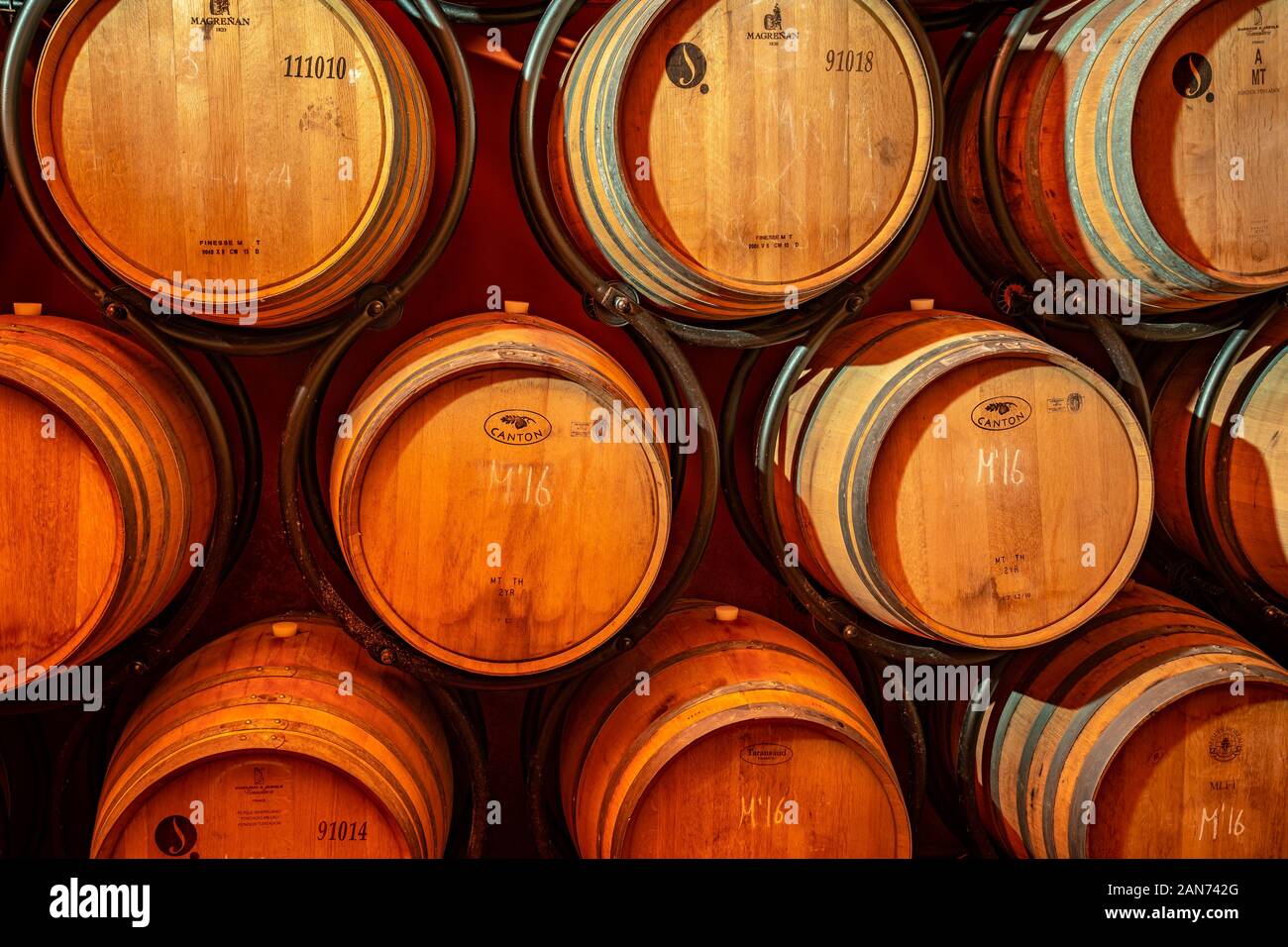 Barcelona, Spain Wine barrels stacked in a cellar Stock Photo Alamy