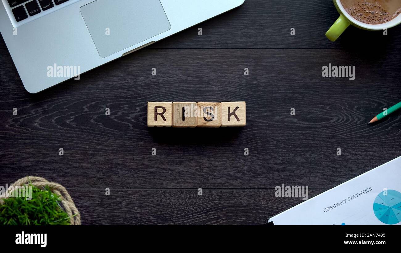 Risk word made of wooden cubes, ability to achieve success in career ...