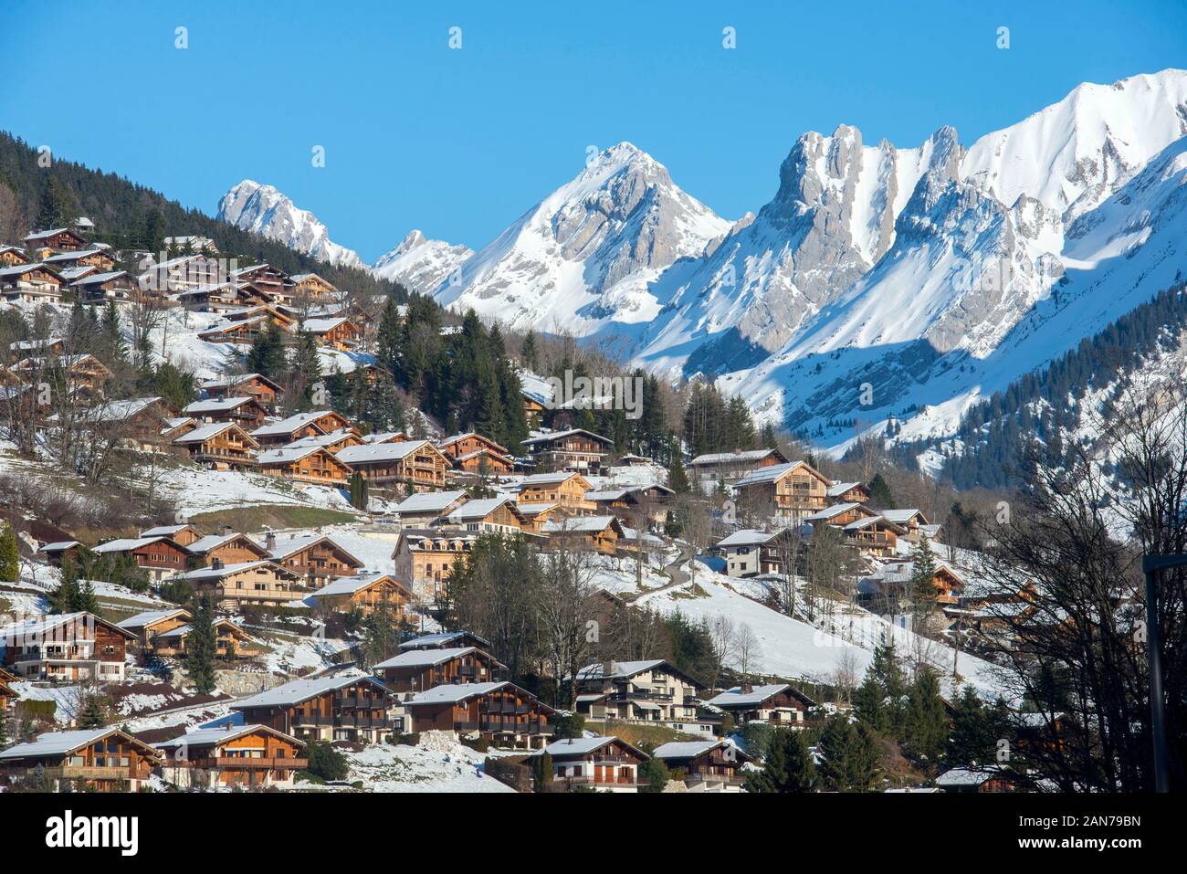 La Clusaz ski resort and sunny snow covered mountains in the Haute-Savoie department in the Auvergne-Rhône-Alpes region in south-eastern France Stock Photo