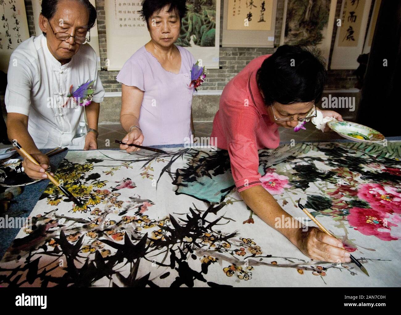 Chinese artists painting flowers Stock Photo