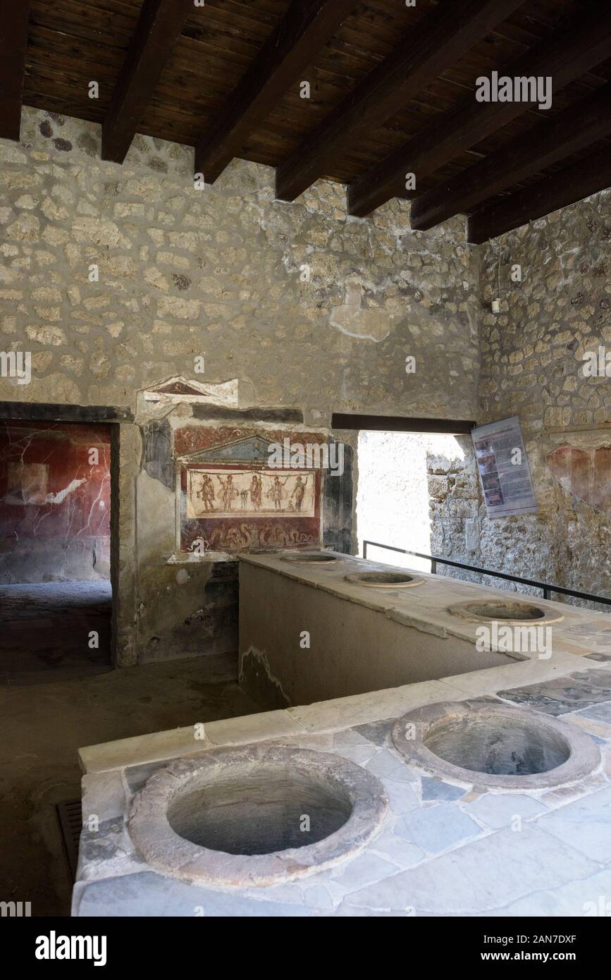 Pompei. Italy. Archaeological site of Pompeii. House and Thermopolium of Vetutius Placidus on via dell’Abbondanza (Casa e Thermopolium di Vetutius Pla Stock Photo