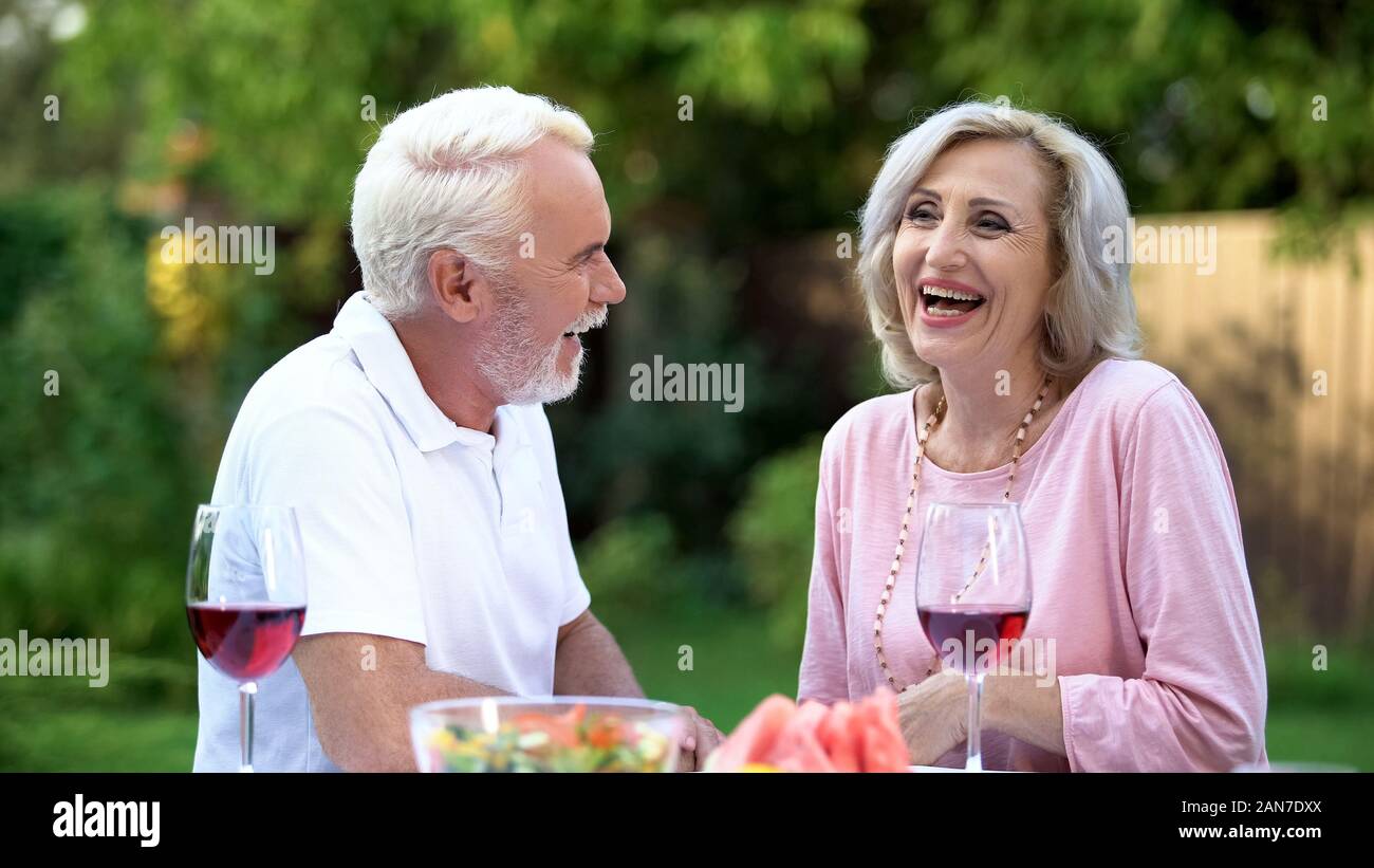 Senior couple laughing at dining table, telling funny jokes, remembering moments Stock Photo - Alamy Senior couple laughing at dining table, telling funny jokes, remembering moments Stock Photo - Alamy
