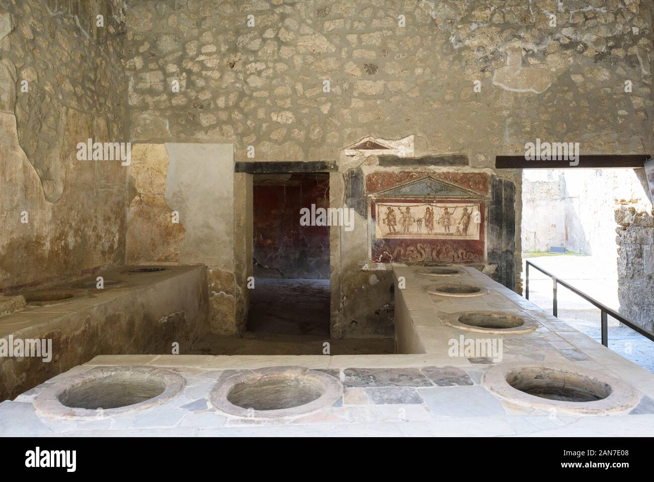 Pompei. Italy. Archaeological site of Pompeii. House and Thermopolium of Vetutius Placidus on via dell’Abbondanza (Casa e Thermopolium di Vetutius Pla Stock Photo