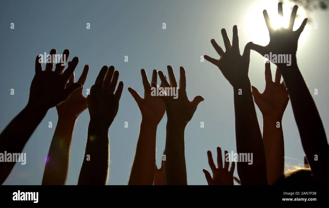 People raising hands, voting for democracy, volunteering campaign, leadership Stock Photo