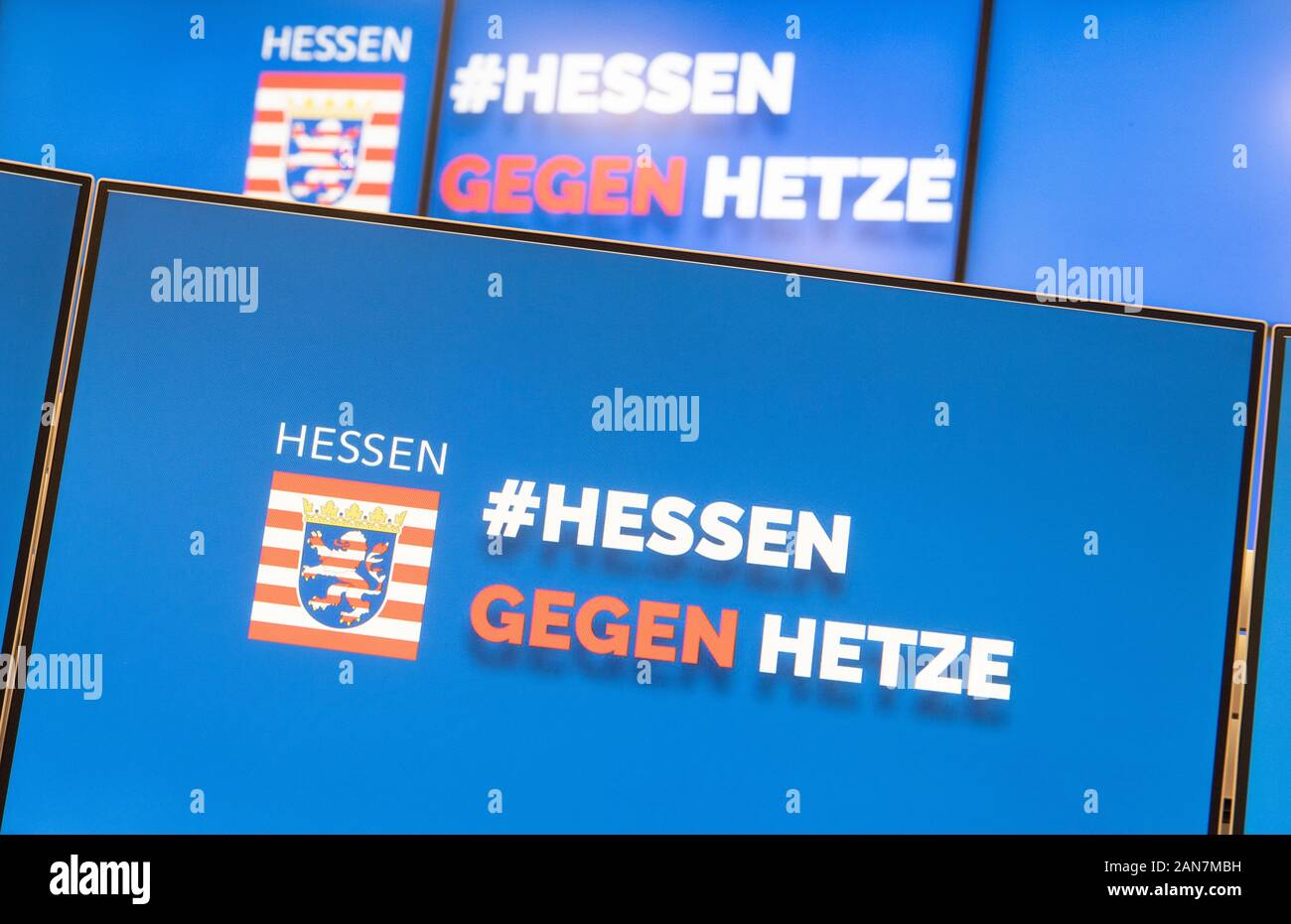 Wiesbaden, Germany. 16th Jan, 2020. Monitors with the inscription "Hessen gegen Hetze" (Hesse against agitation) stand next to each other during the official commissioning of the central reporting office "Hessen 3C". In future, Internet users will be able to report hate comments in social media via the platform. Credit: Boris Roessler/dpa/Alamy Live News Stock Photo