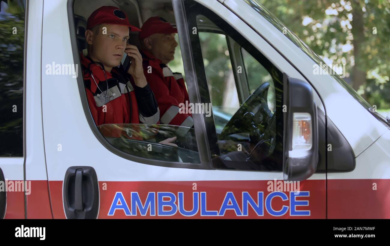 Emergency ambulance answering call hi-res stock photography and images ...
