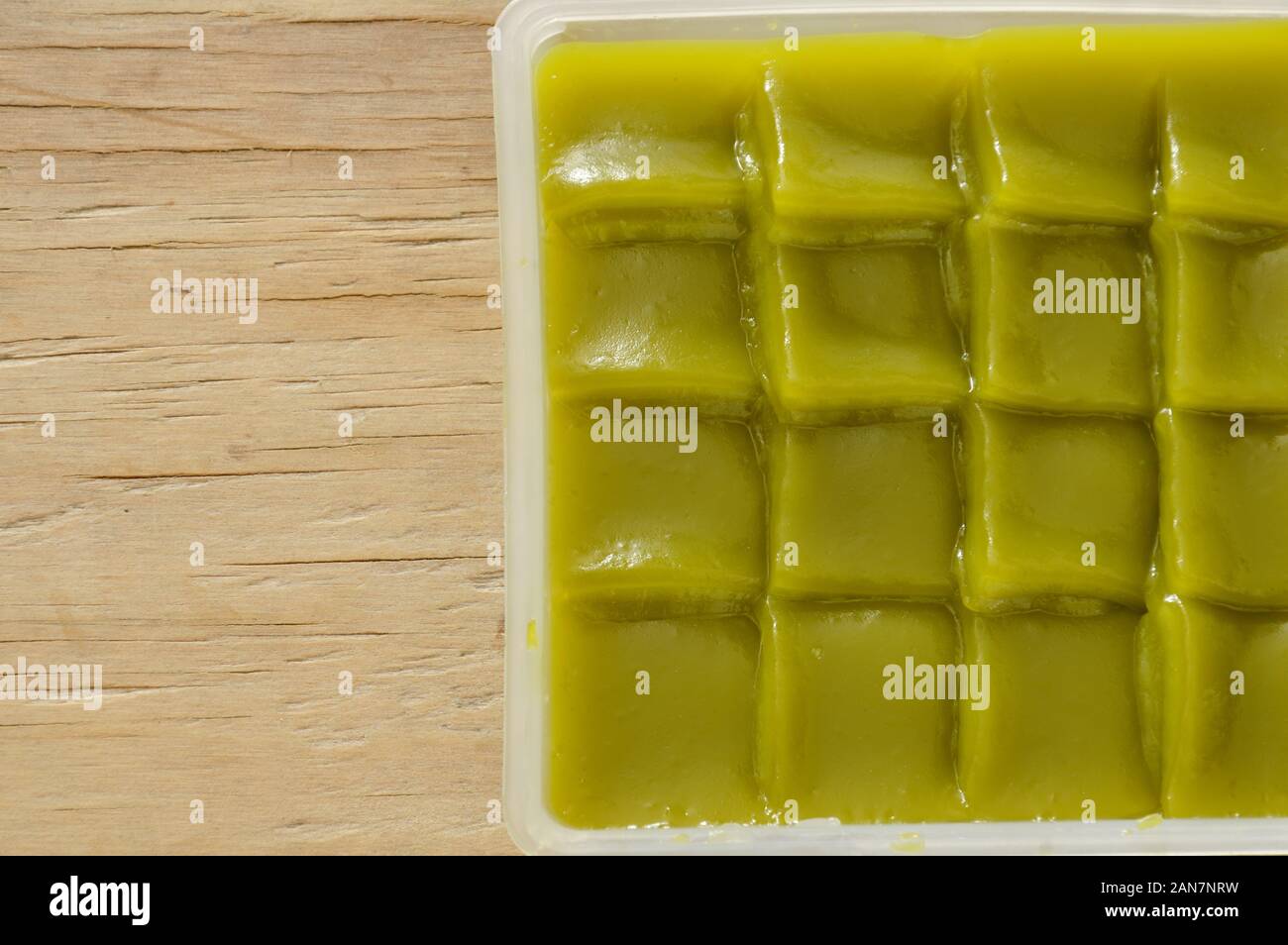 green layer sweet sticky cake Thai dessert on plastic tray Stock Photo