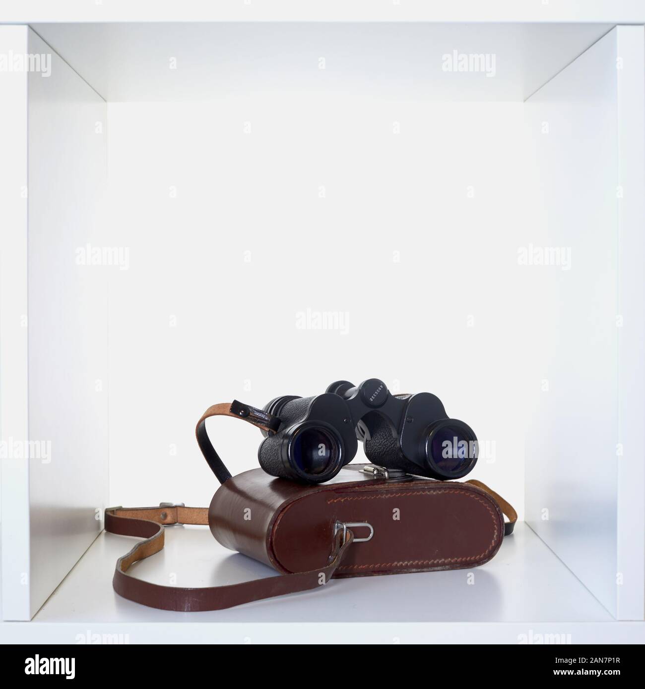 Vintage binoculars inside a white cube Stock Photo Alamy