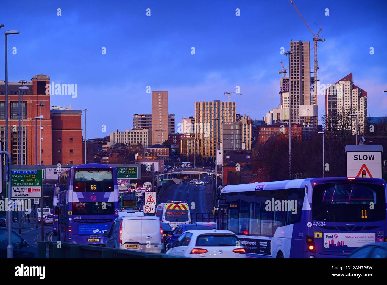 traffic jam heading into the city of Leeds at sunrise yorkshire united kingdom Stock Photo