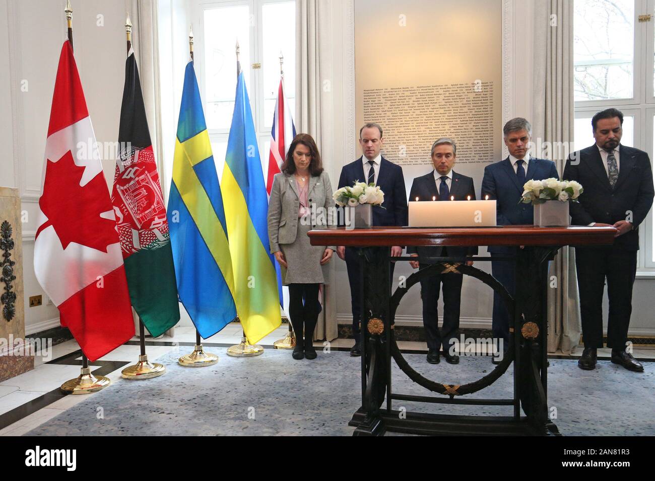 (left to right) Ann Linde, Swedish Minister of Foreign Affairs, Foreign Secretary Dominic Raab, Francois-Philippe Champagne, Canadian Minister of Foreign Affairs, Vadym Prystaiko, Ukrainian Minister of Foreign Affairs, and Idrees Zaman, Acting Foreign Minister for Afghanistan, during a moment of reflection at Canada House, central London for the passengers of the Ukrainian International Airlines flight that crashed just minutes after taking off from Imam Khomeini International Airport in Tehran, killing 176 people. Stock Photo